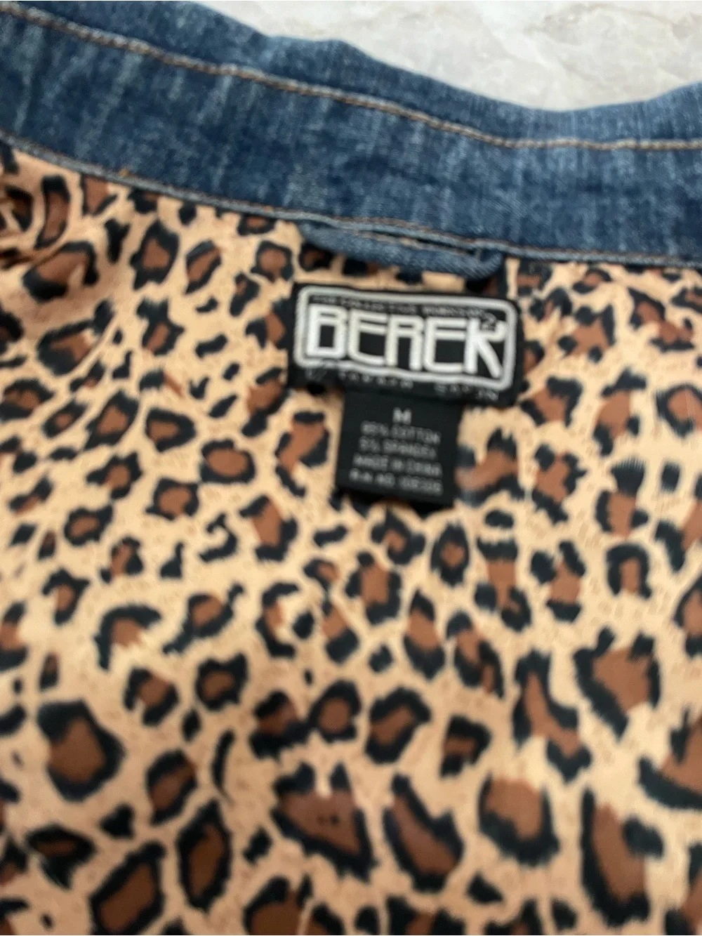 Berek Denim Jacket with leopard print facing at collar & cuffs.